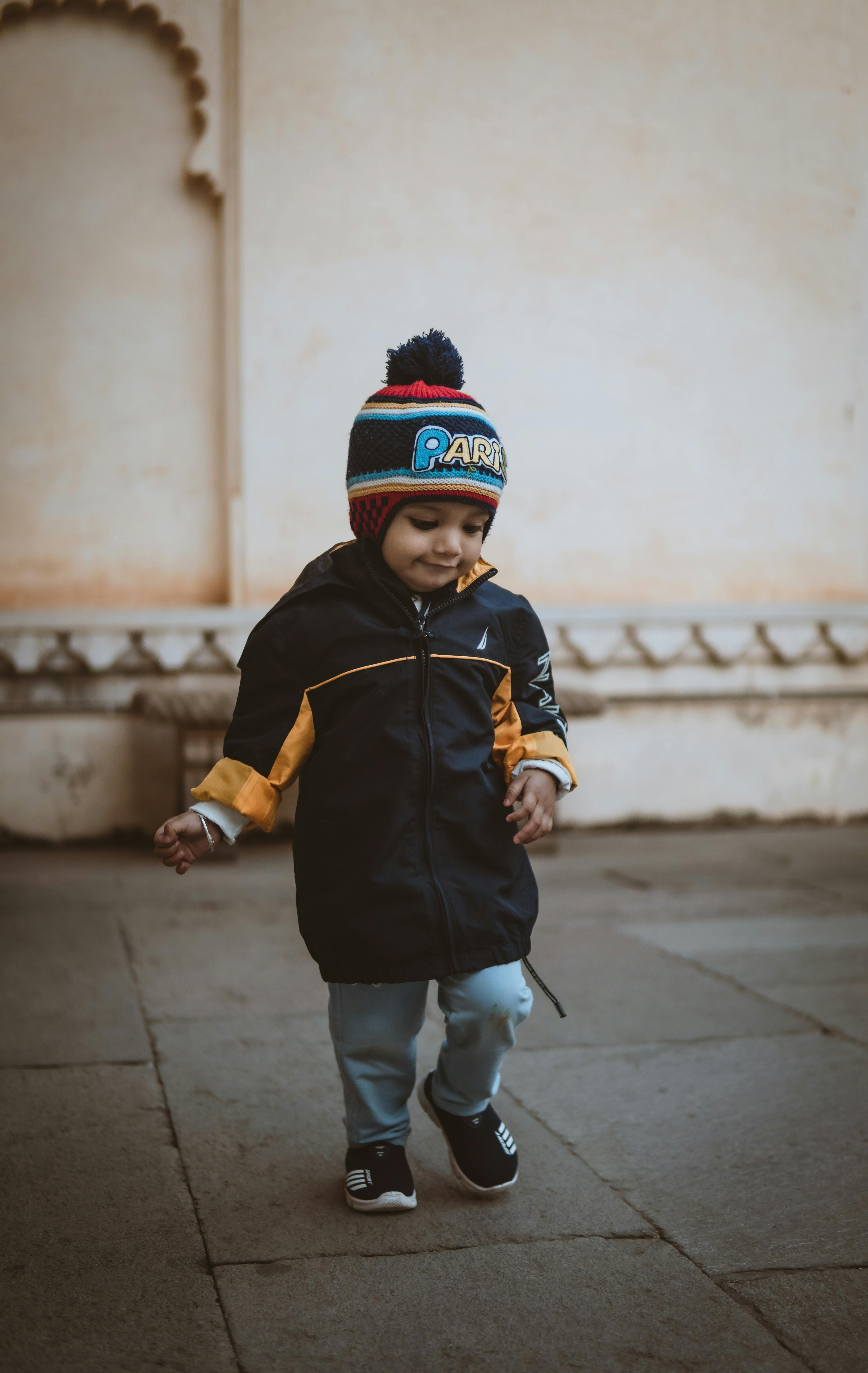 Little Boy on a Square in Winter · Free Stock Photo