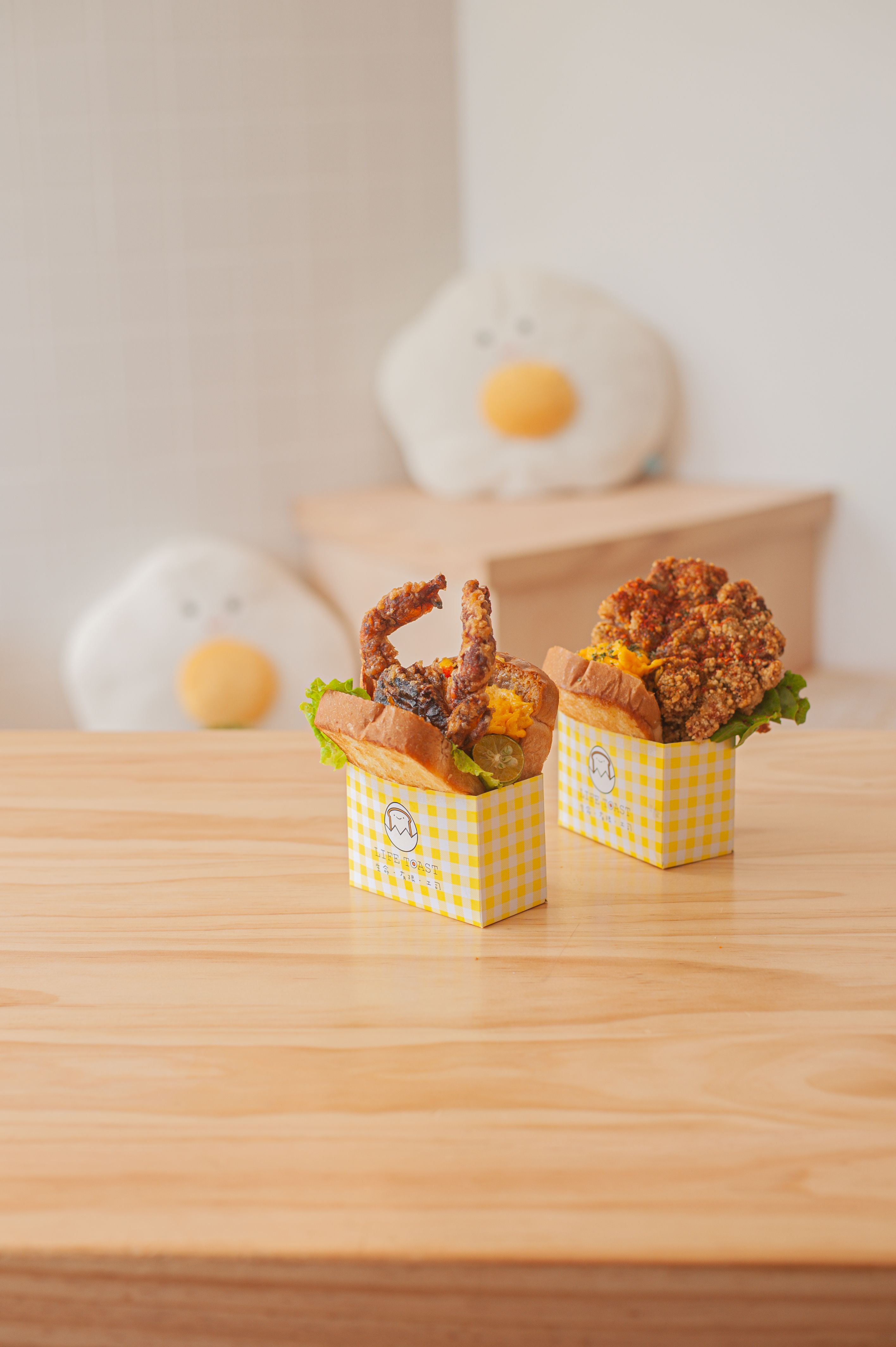 Appetizing fried chicken served in checkered boxes, perfect for food lovers.