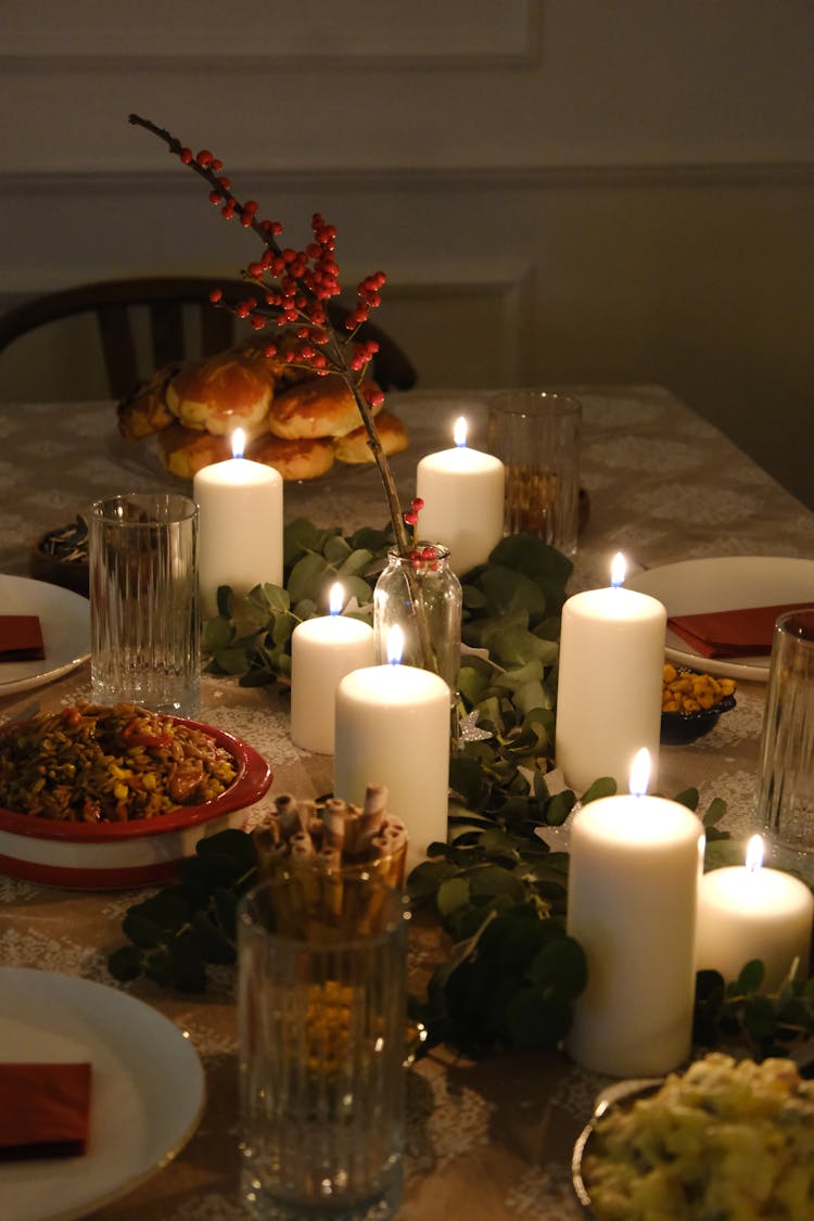 Food And Candles On A Christmas Dinner Table 