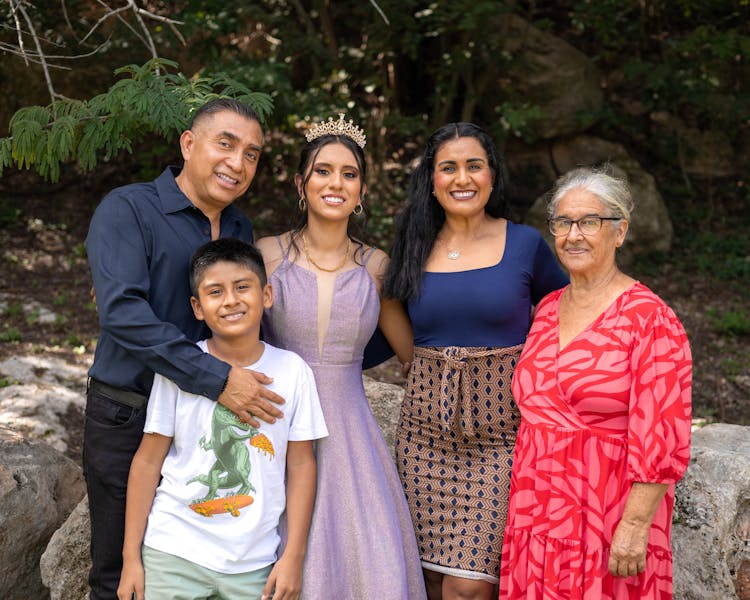 Smiling Family With Bride In Crown