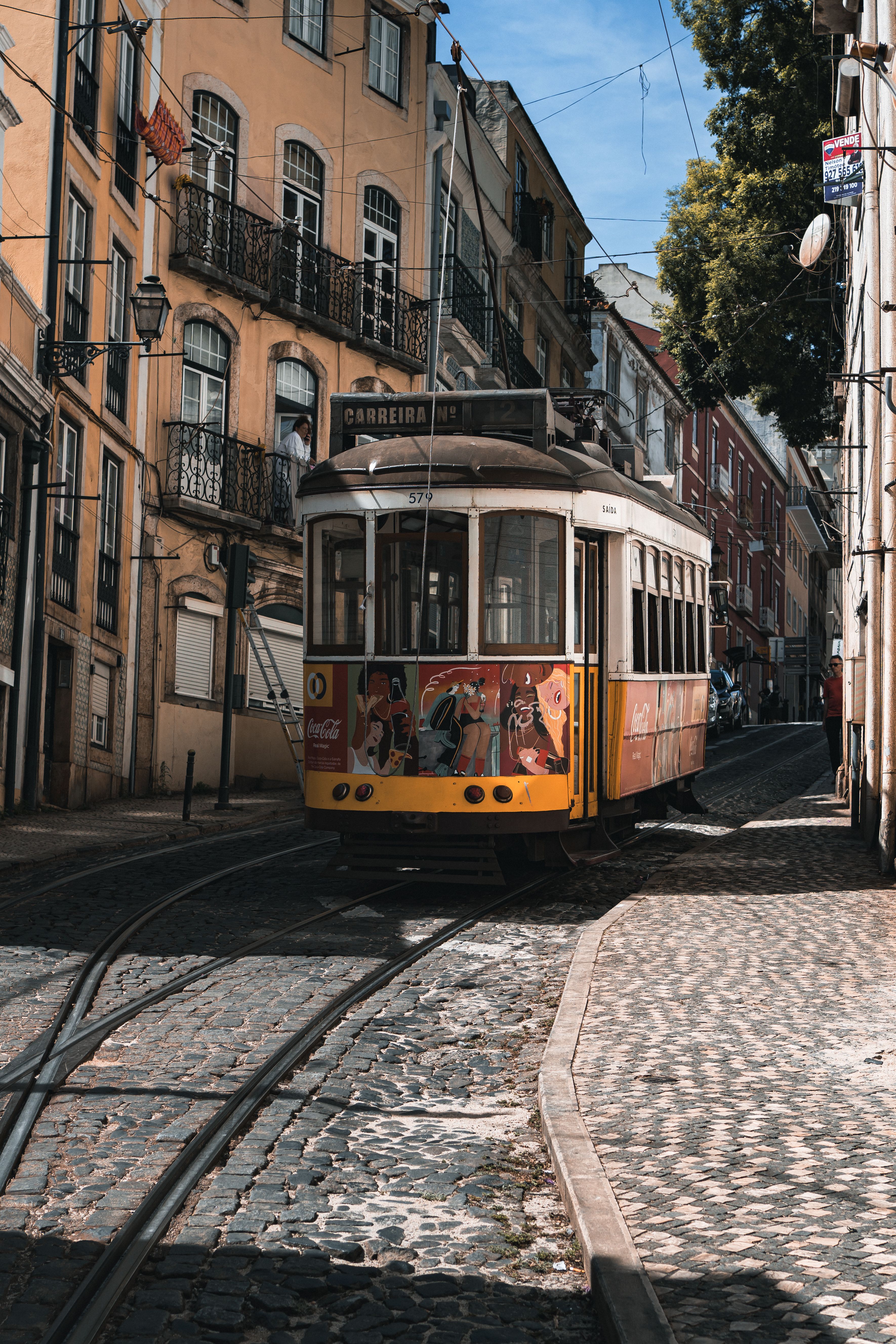 Tram in a Narrow Alley in Lisbon · Free Stock Photo