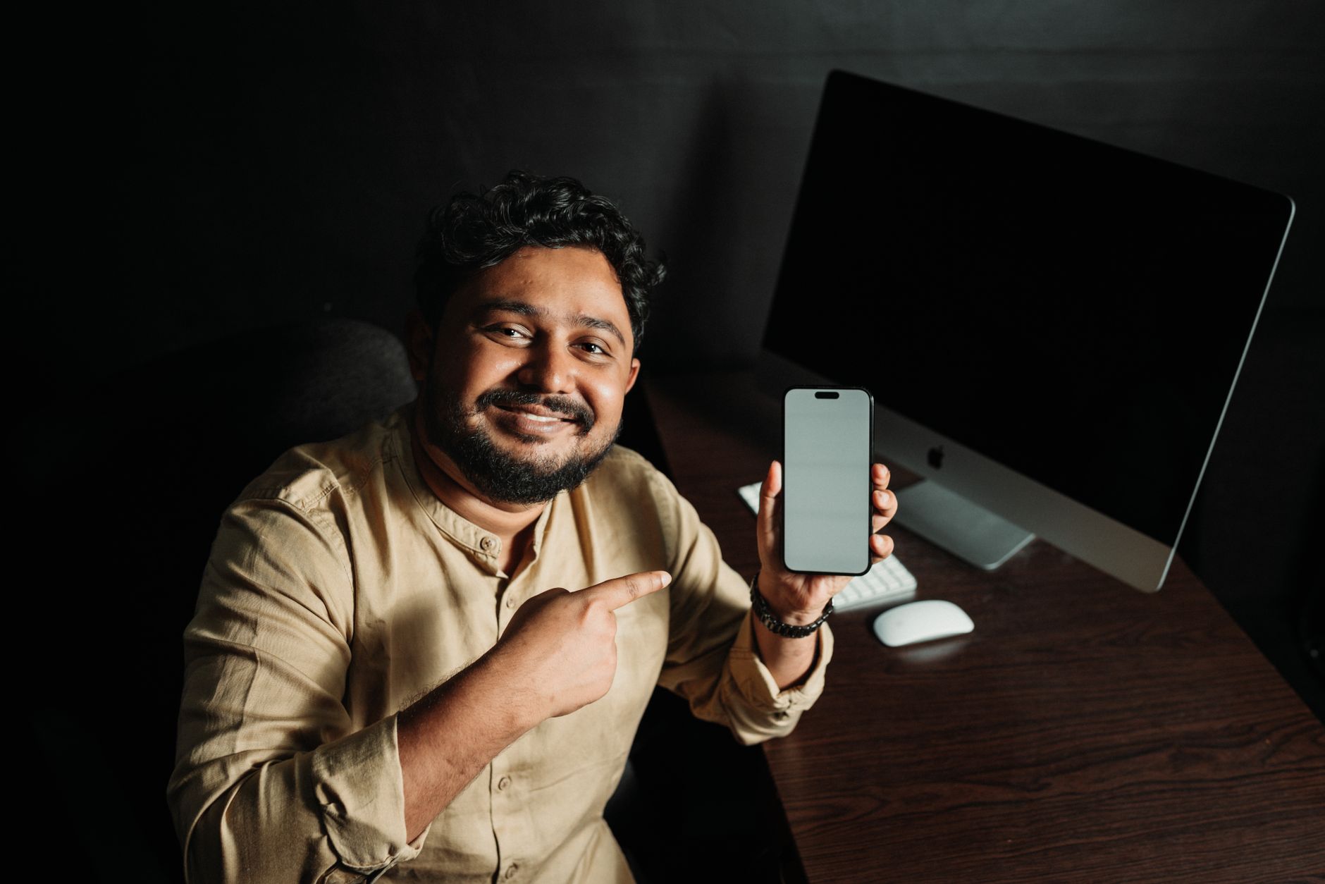 An Indian smartphone displaying a withdrawal verification screen beside bank documents and a calculator