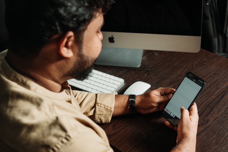 Office Worker Checking His Phone