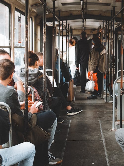 People in Wagon of Tram