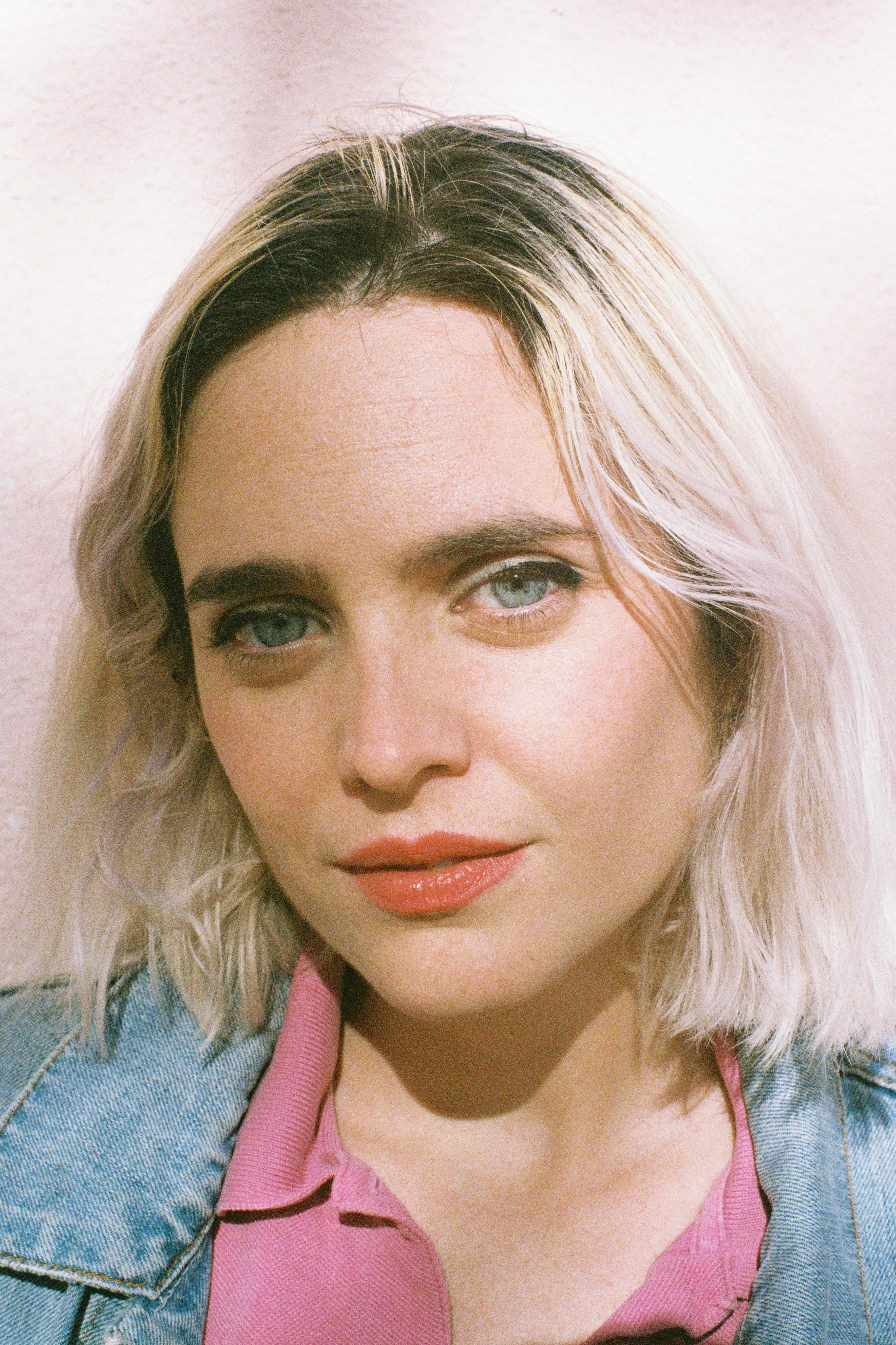 Candid portrait of a Caucasian woman with blonde hair, captured in Lisbon.