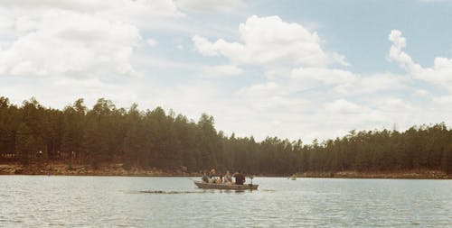 People in Boat on River