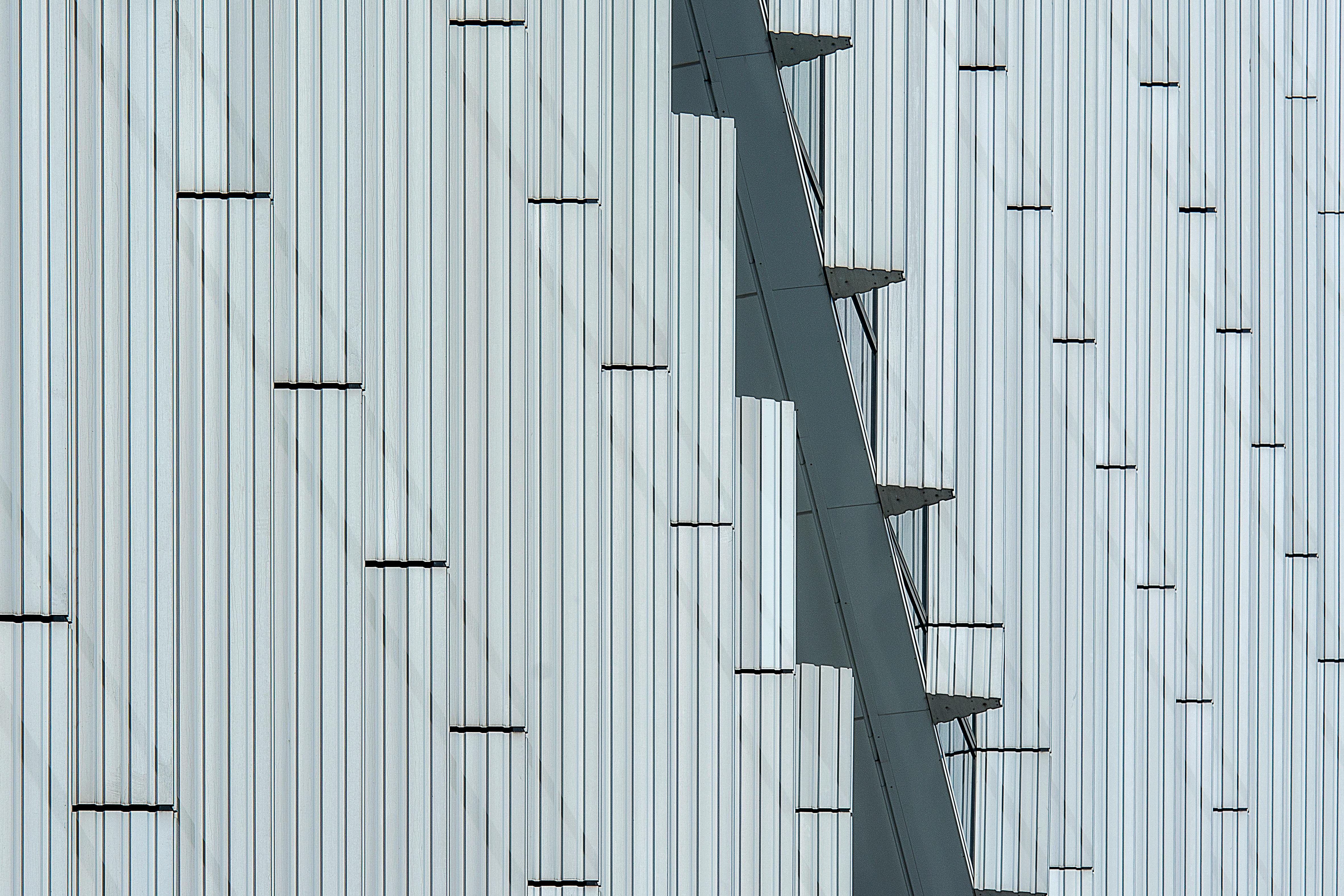 Abstract view of a modern building facade with minimalist pattern and geometric design.