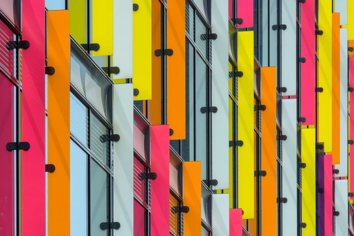 Coloured glass facade catching the light — photo by Jan van der Wolf on Pexels
