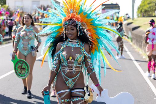 Colorful costumes and joyful celebration at a street carnival in Saint Kitts and Nevis.