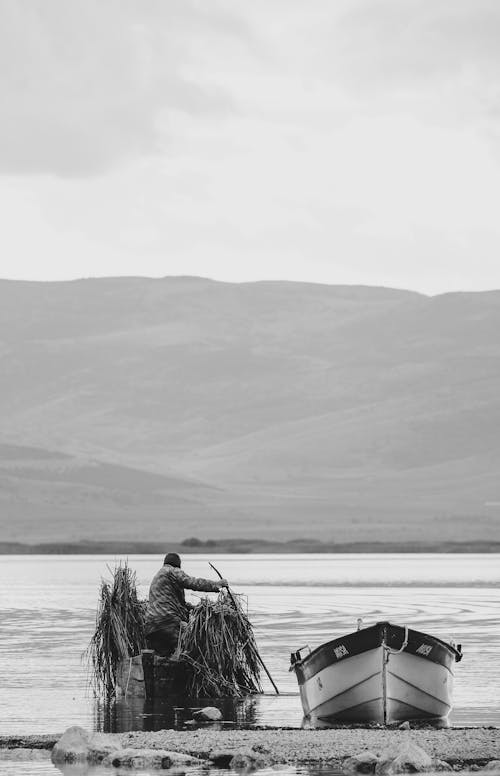 Man on Boat with Seaweed