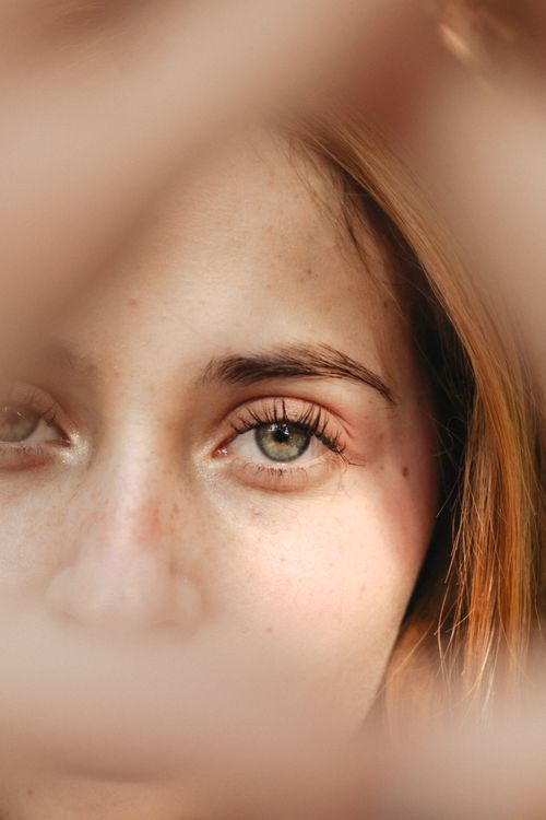 Free A focused close-up photo highlighting a woman's eye and eyebrow, exuding elegance and beauty. Stock Photo