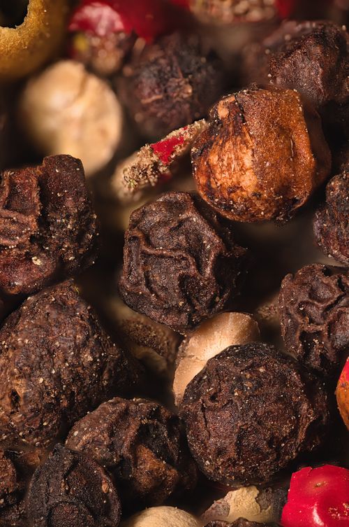 Free A macro shot showcasing a vibrant mix of assorted peppercorns, perfect for seasoning. Stock Photo