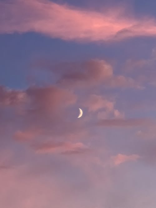 Free Moon Among Clouds on Pink Sky  Stock Photo