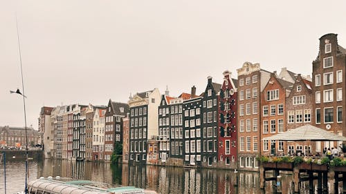 Facades of Apartment Buildings Facing the Canal in Amsterdam, the Netherlands