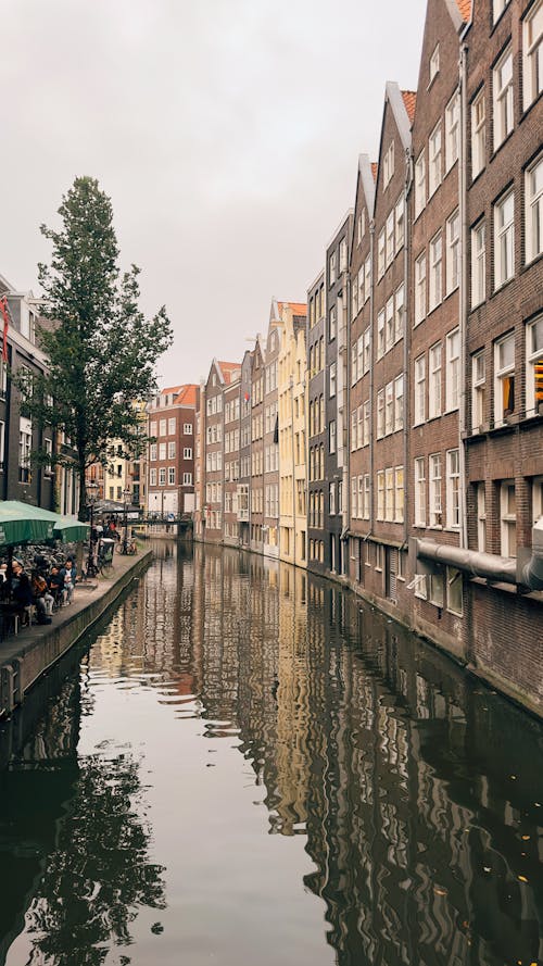 Canal Along Townhouses in Amsterdam, Netherlands