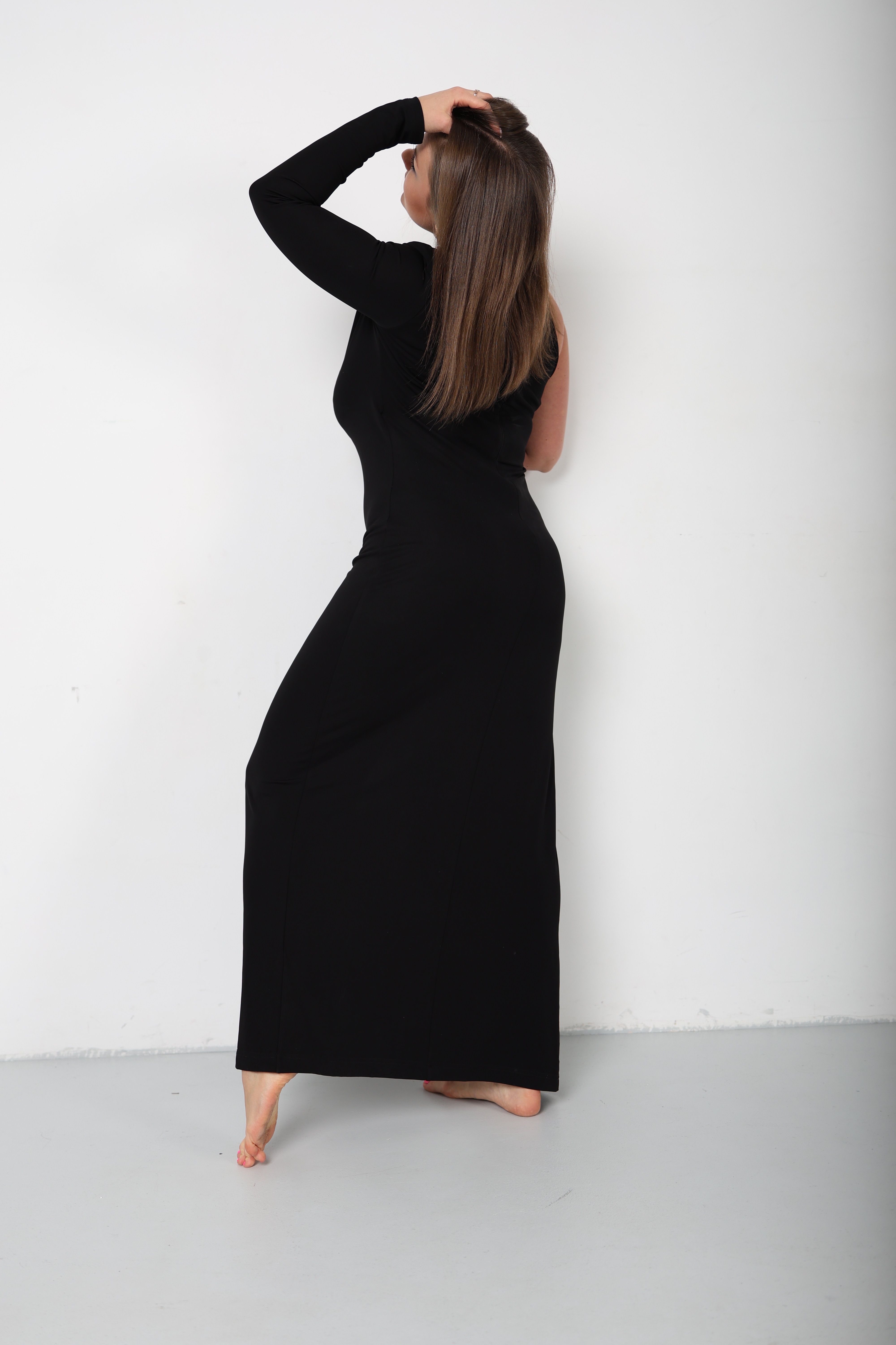 Woman Posing in Black Dress in a Studio · Free Stock Photo