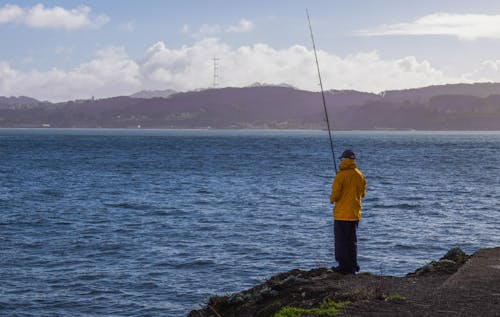 Man Fishing on the Shore
