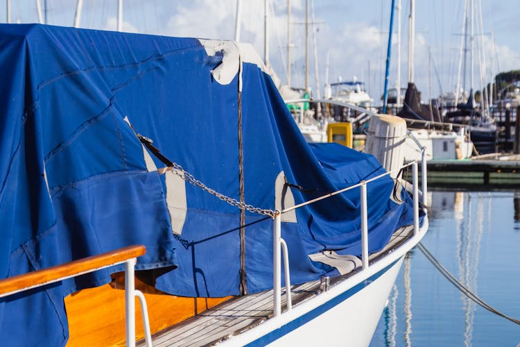 Yacht With Curtain In A Harbor 