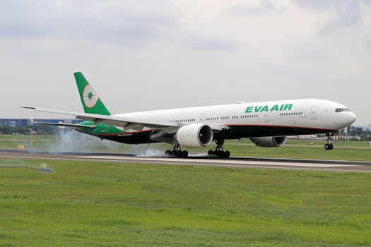 EVA Air Boeing 777 touching down with landing gear smoke at airport.