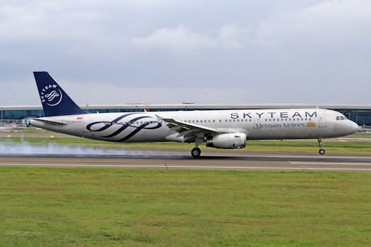 Vietnam Airlines Airbus A321 landing with SkyTeam livery at airport.