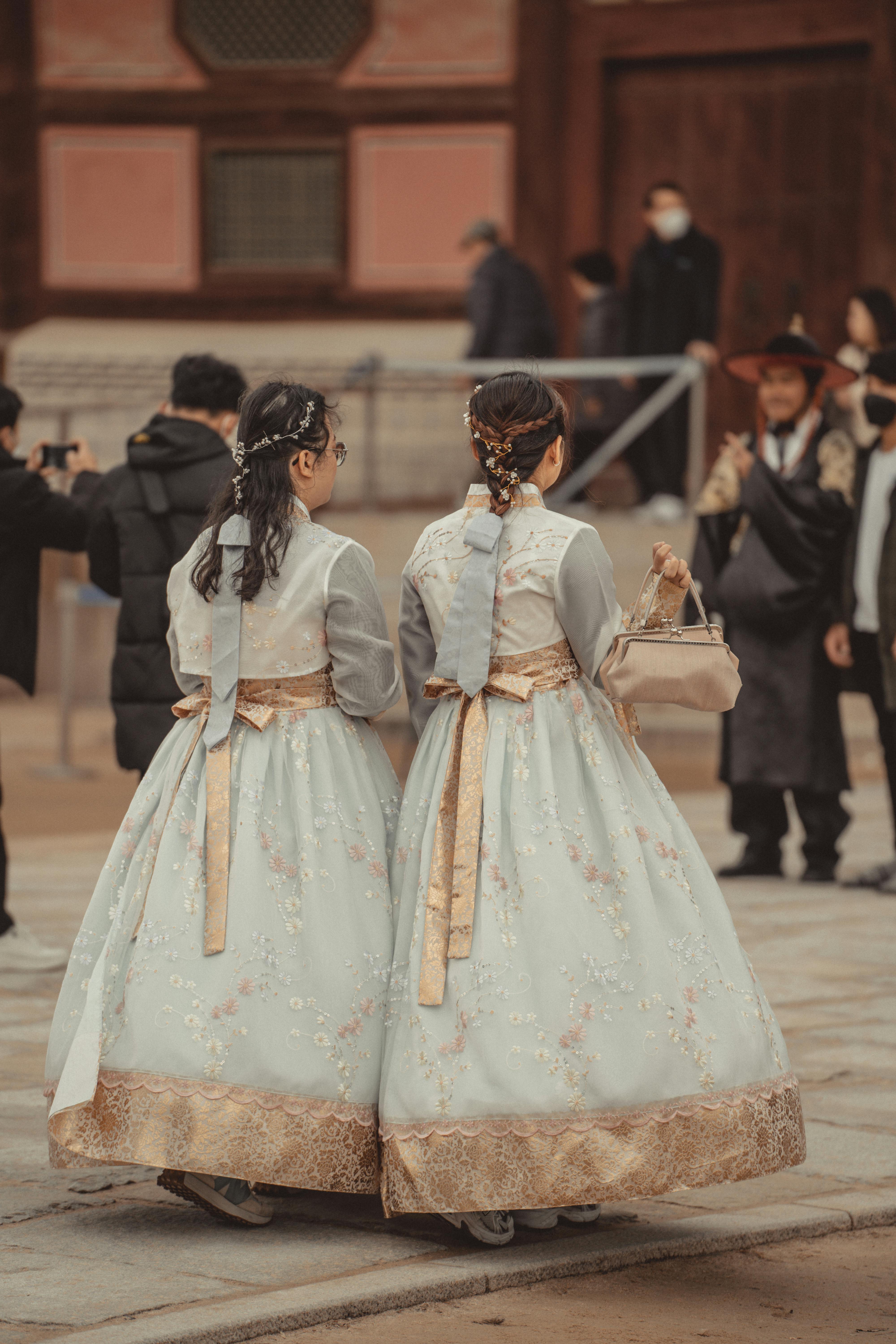 People wearing traditional Korean Hanbok clothing