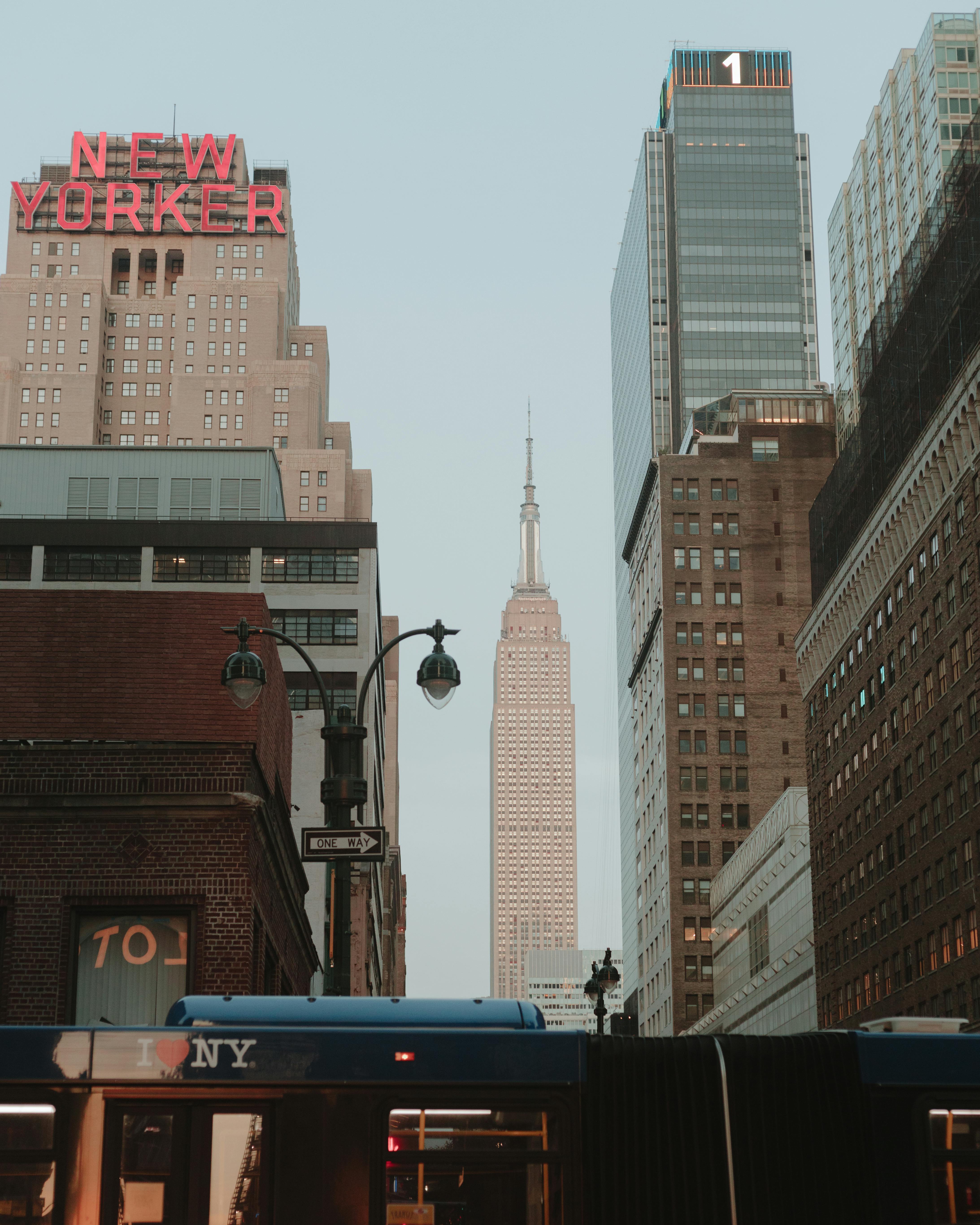 The Empire State Building rises in New York City, showcasing the urban skyline and architecture.