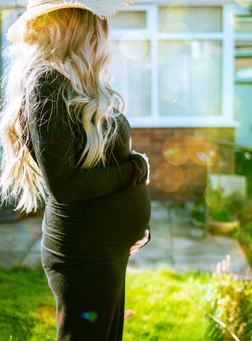 Pregnant Woman Holding Own Tummy