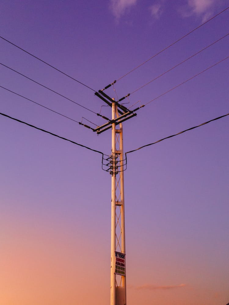 Low Angle Shot Of An Electricity Pole At Sunset