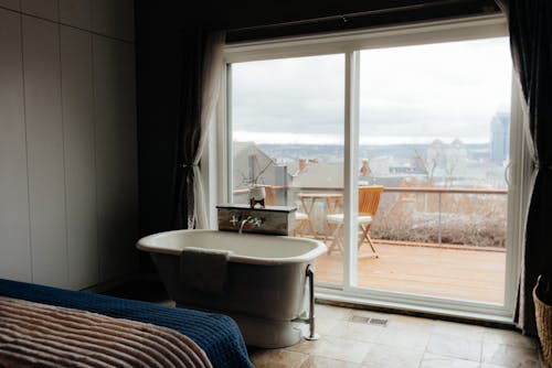 Bedroom with Bathtub and Balcony