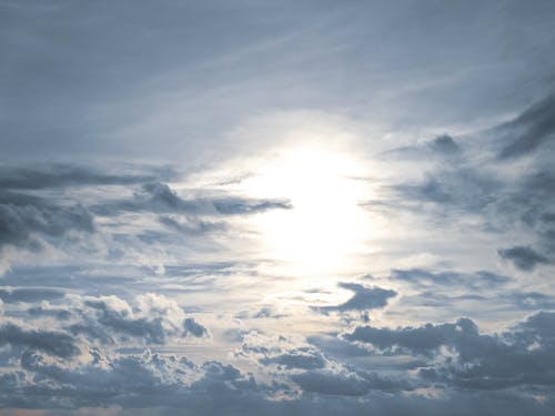 Free View of the Sky with Clouds and Bright Sunlight  Stock Photo