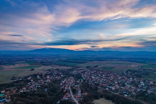 Free Scenic aerial view of Bałsza village in Bulgaria with a colorful twilight sky. Stock Photo