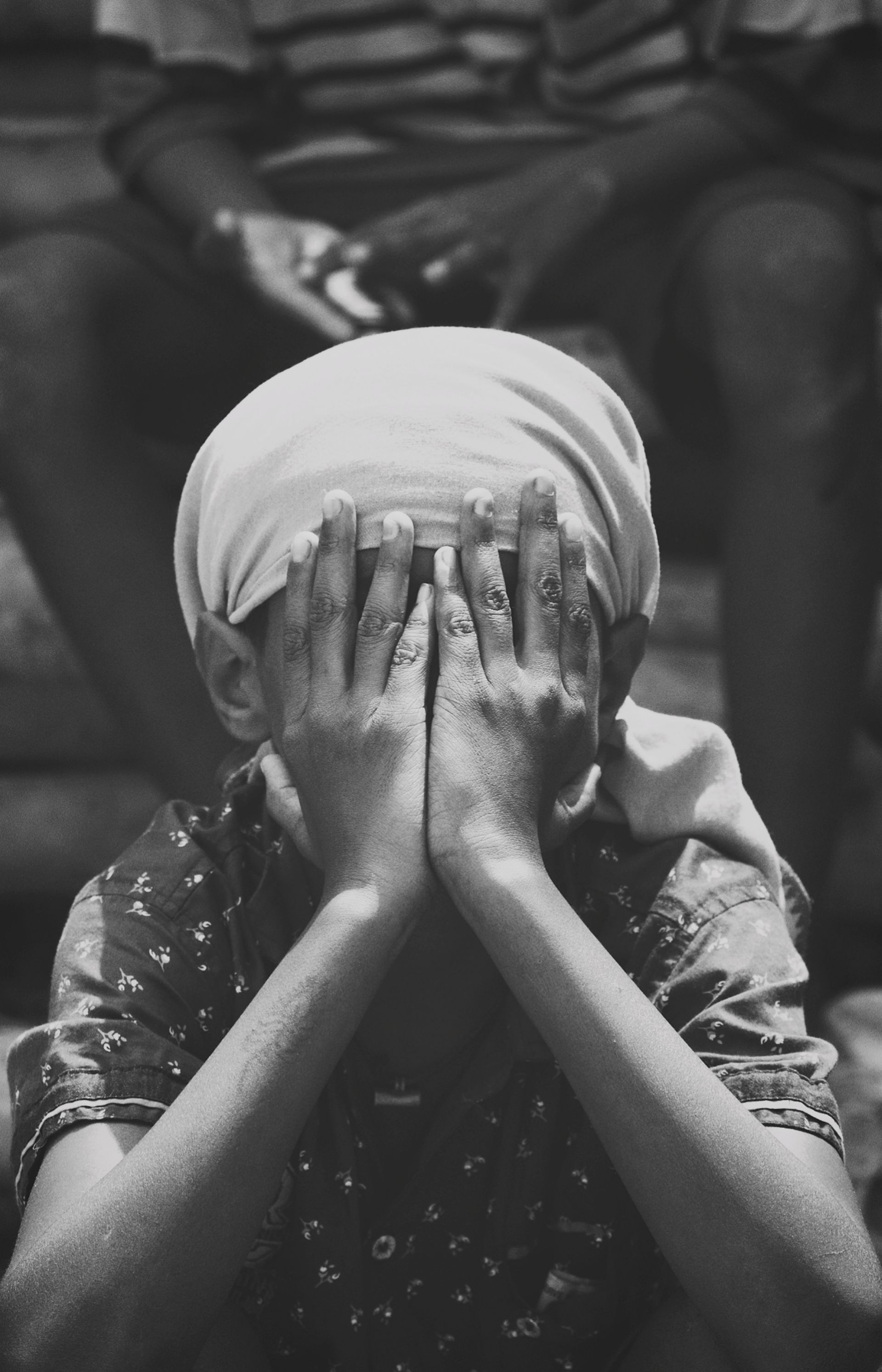 Sad Child with Hands on Face · Free Stock Photo