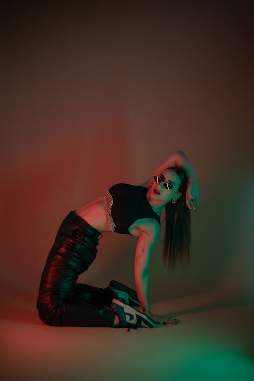 Young Woman in a Trendy Outfit Posing in Studio 