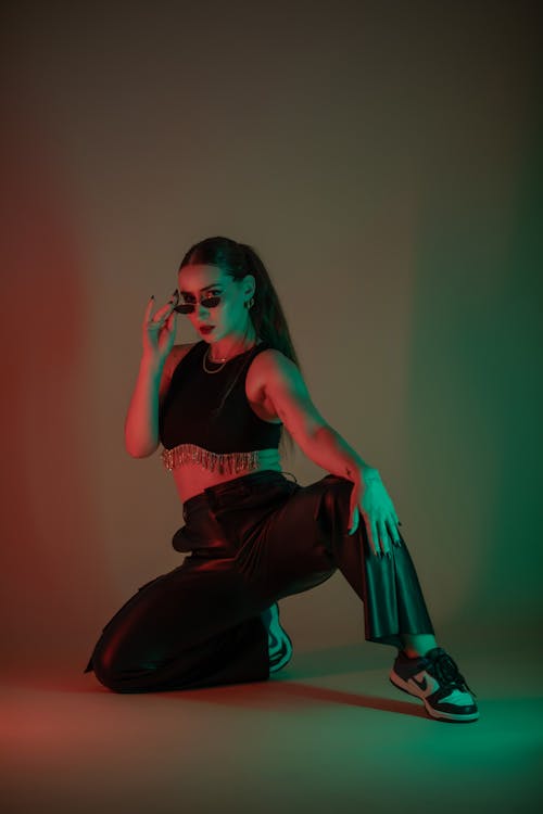 Young Woman in a Trendy Outfit Posing in Studio 