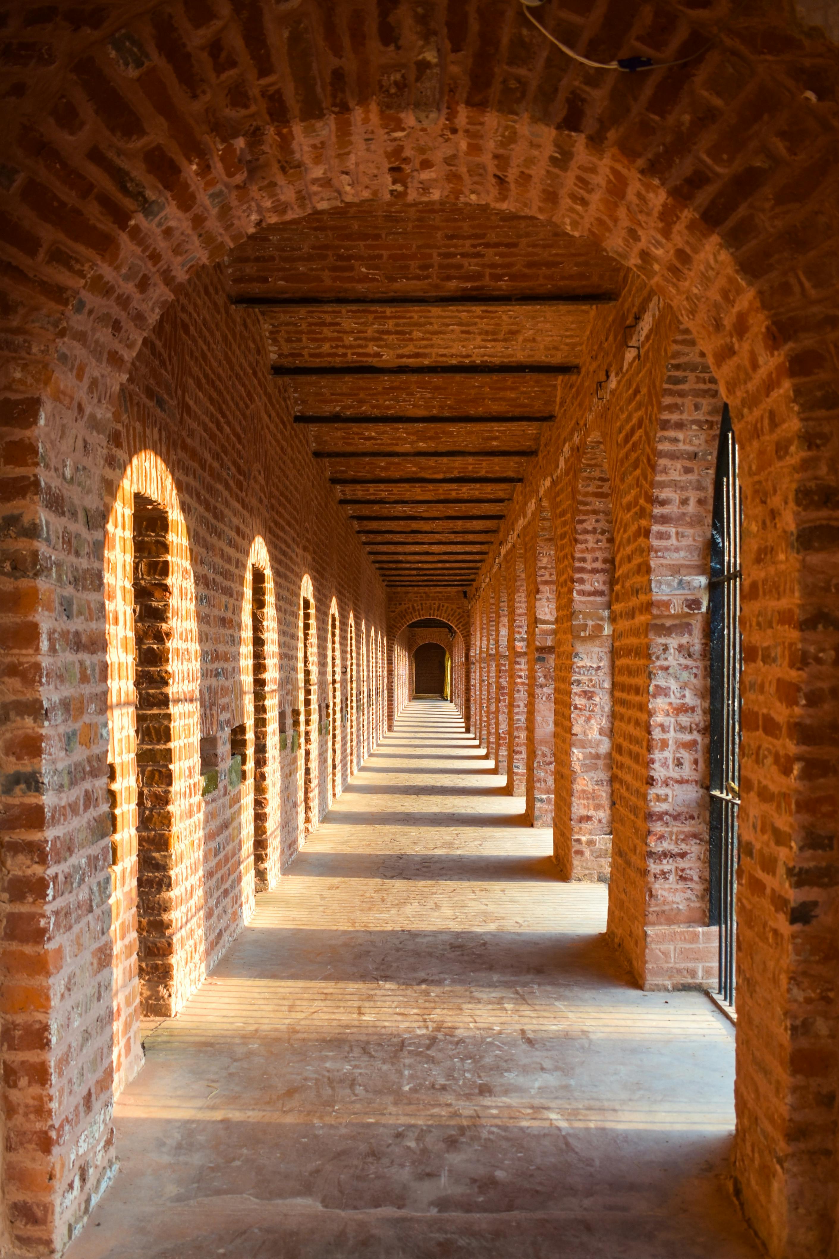 Long corridor of white-arched cells inside the Cellular Jail in Port Blair, Andaman Islands
