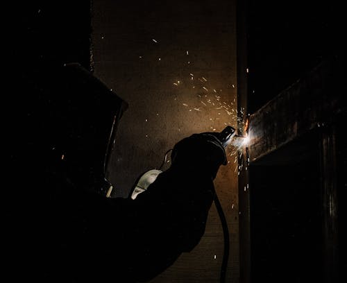 Worker Welding in Dark