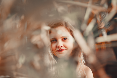 Free Artistic photo of a smiling blonde woman with blurred foreground, captured in São Paulo. Stock Photo