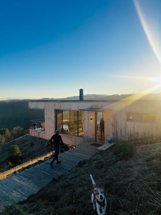 People in Wooden House on Mountainside