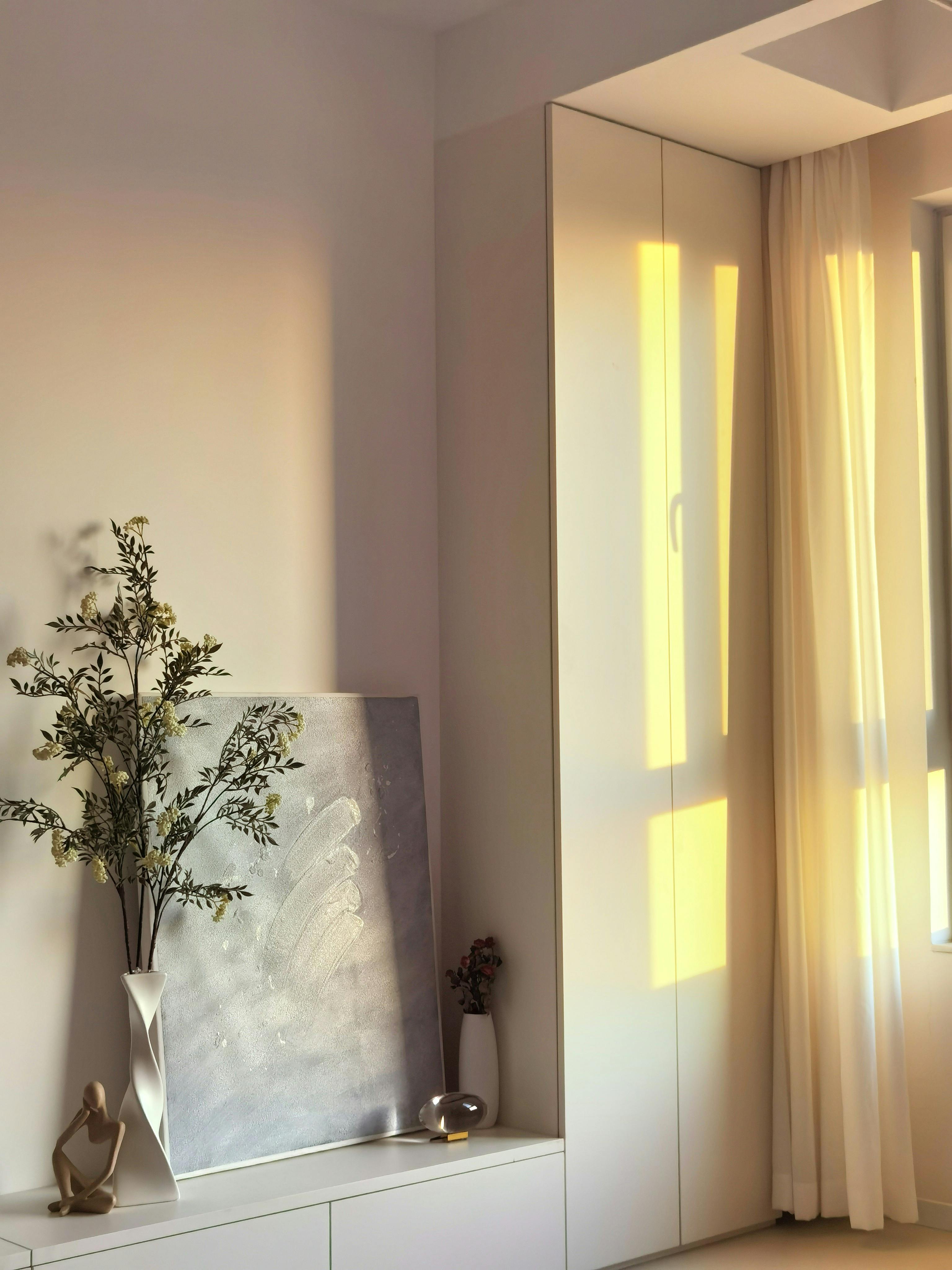 A sunlit interior space with elegant decor, featuring a vase and modern furnishings in Baodi District, Tianjin.