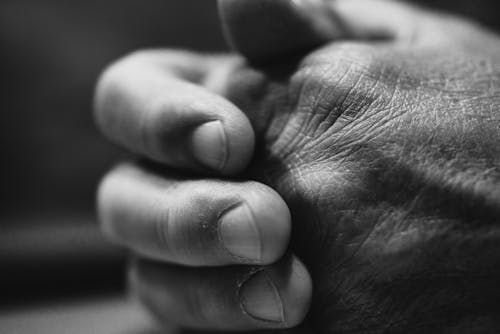 Black and White Close-up of Hands of a Man 