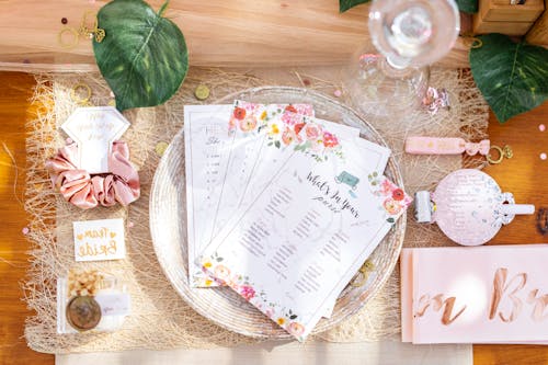 Top View of Cards Lying on a Plate with Decorations around It 