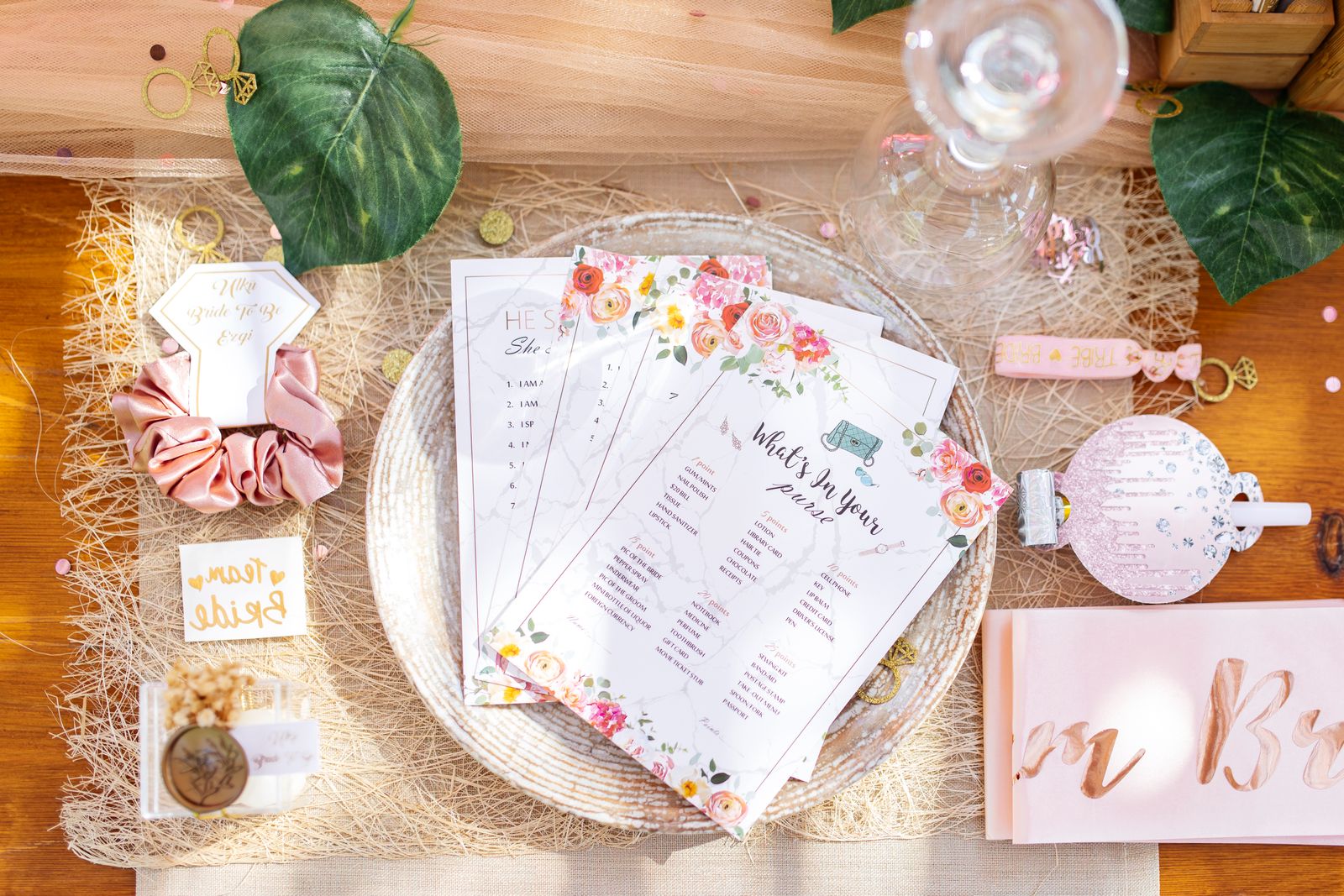 Bridal-shower table details with cards and simple floral decorations.