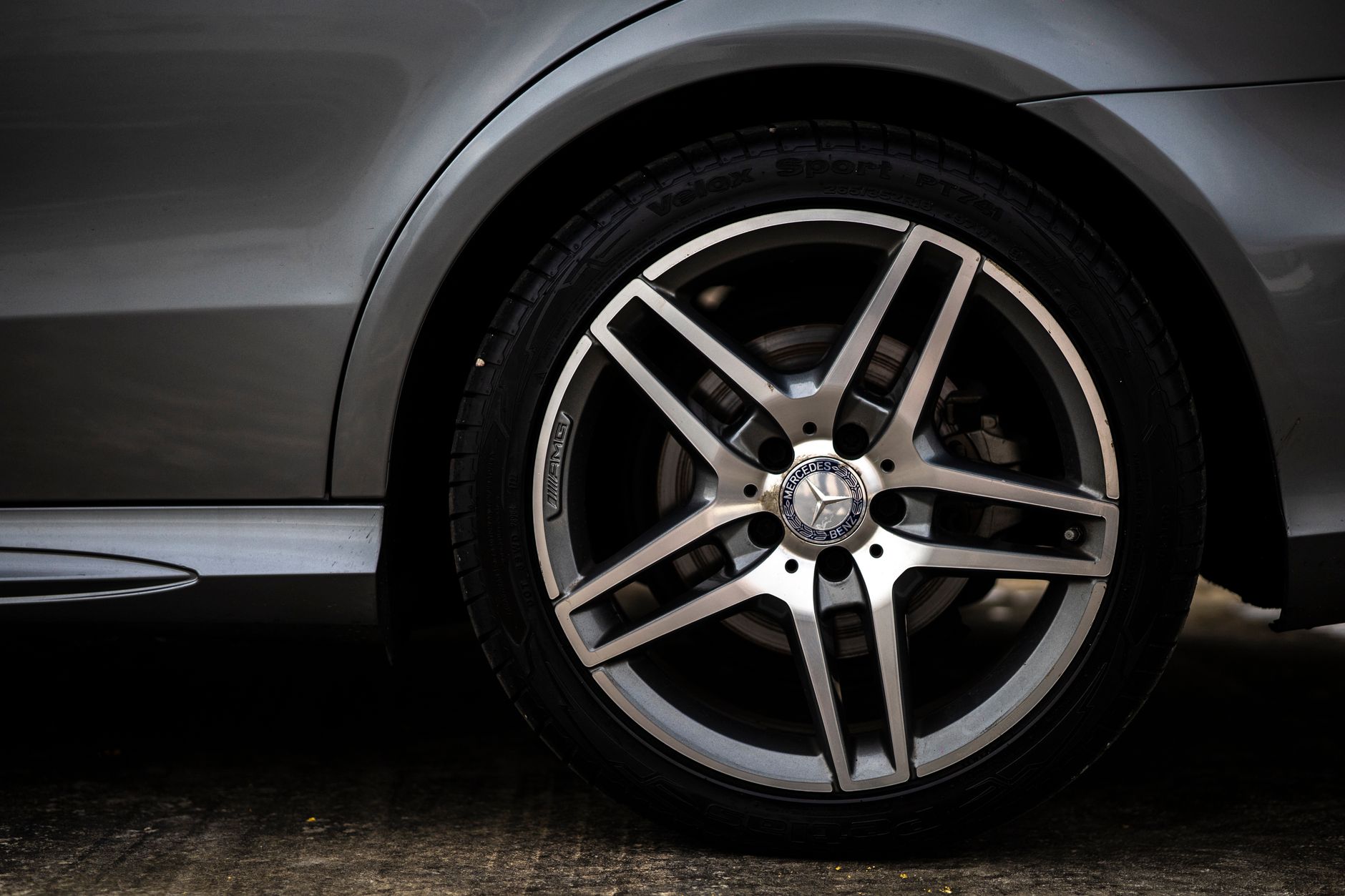 Detailed close-up of a luxury car's wheel and tire in Selangor, Malaysia.
