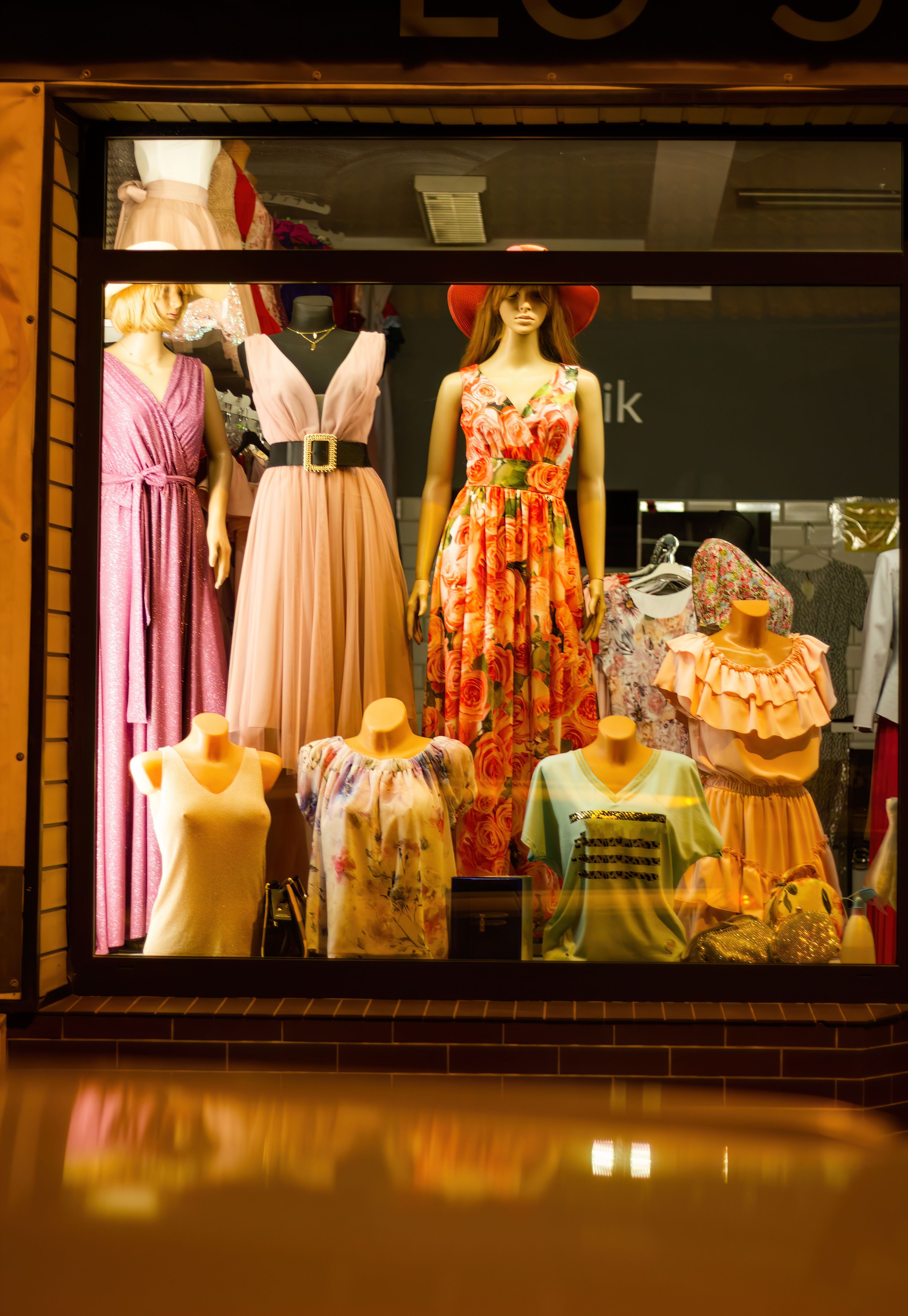Elegant window display lit at night