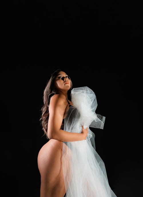 Model in Lingerie Holding a Sheet of Chiffon