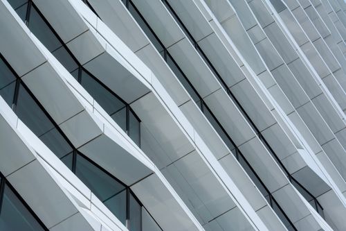 Free Close-up of a modern architectural facade with geometric patterns, showcasing urban design. Stock Photo