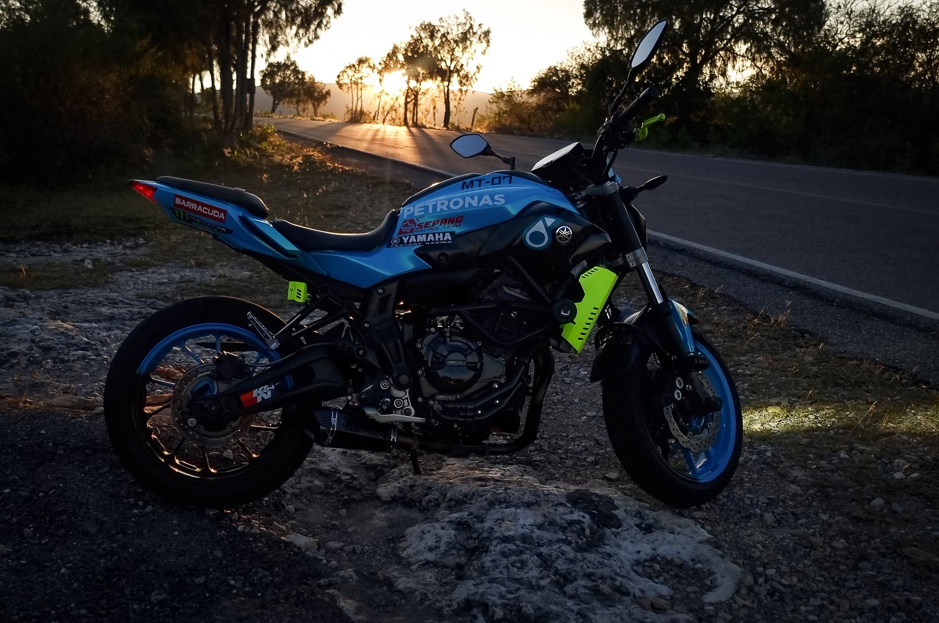 A vibrant motorcycle captured against a stunning sunset in San Luis Potosí, Mexico.