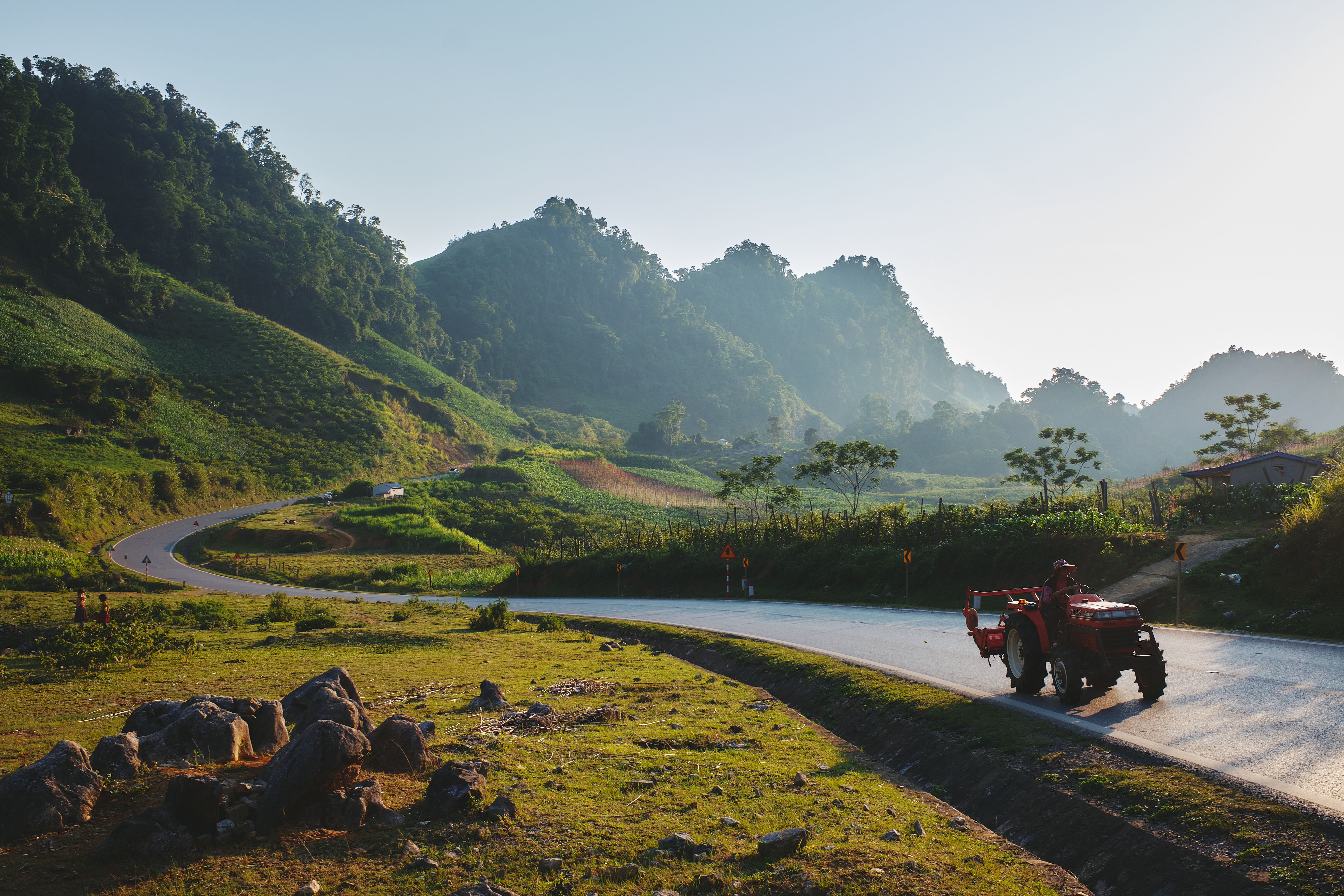 Man Riding Tractor on Mountain Landscape · Free Stock Photo