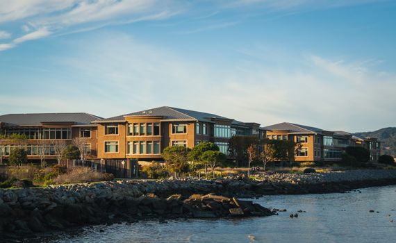 Stunning office complex located by the tranquil seashore with rocky coastline.