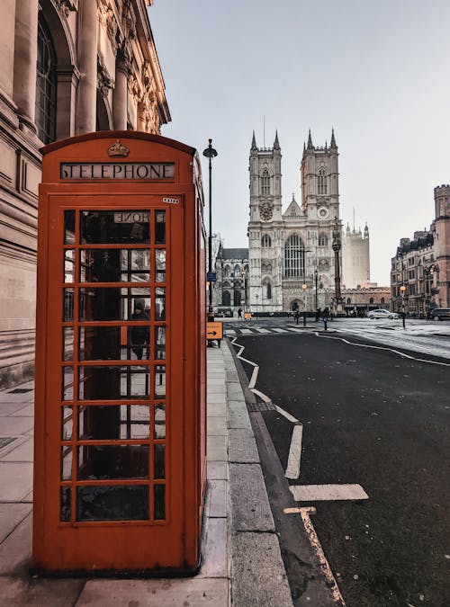 View of a Red Telephone Booth and the Westminster Abbey in London, England, UK 